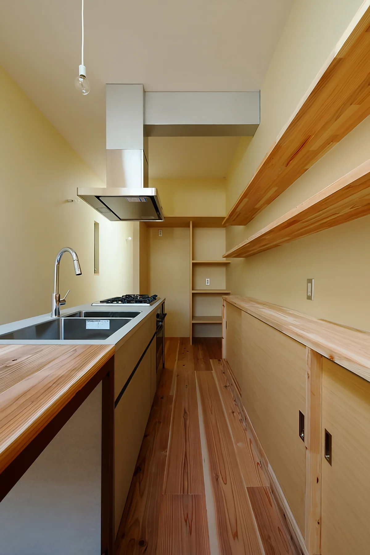 Custom kitchen; bespoke storage solutions developed due to the compact site
