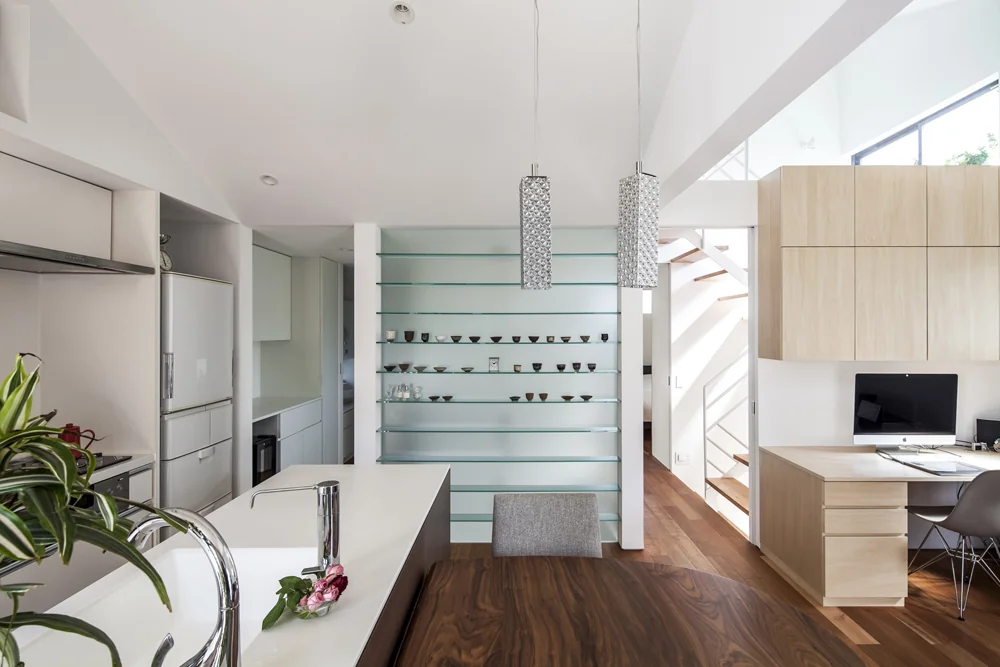 The front glass shelves showcase works produced in the atelier.