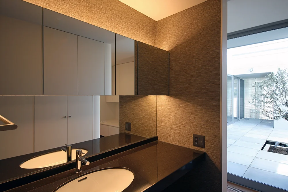 The powder room offers a view of the bright courtyard.