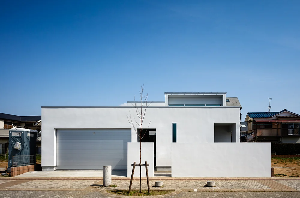 The courtyard house opens inward, preserving privacy from the street-facing side.