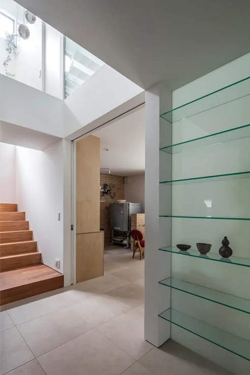 The tiled flooring extends seamlessly from the entrance through to the southern terrace.
