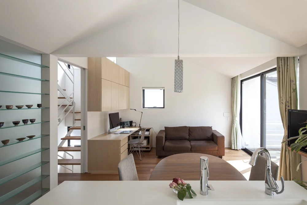 A partial wall subtly delineates the dining and living areas.