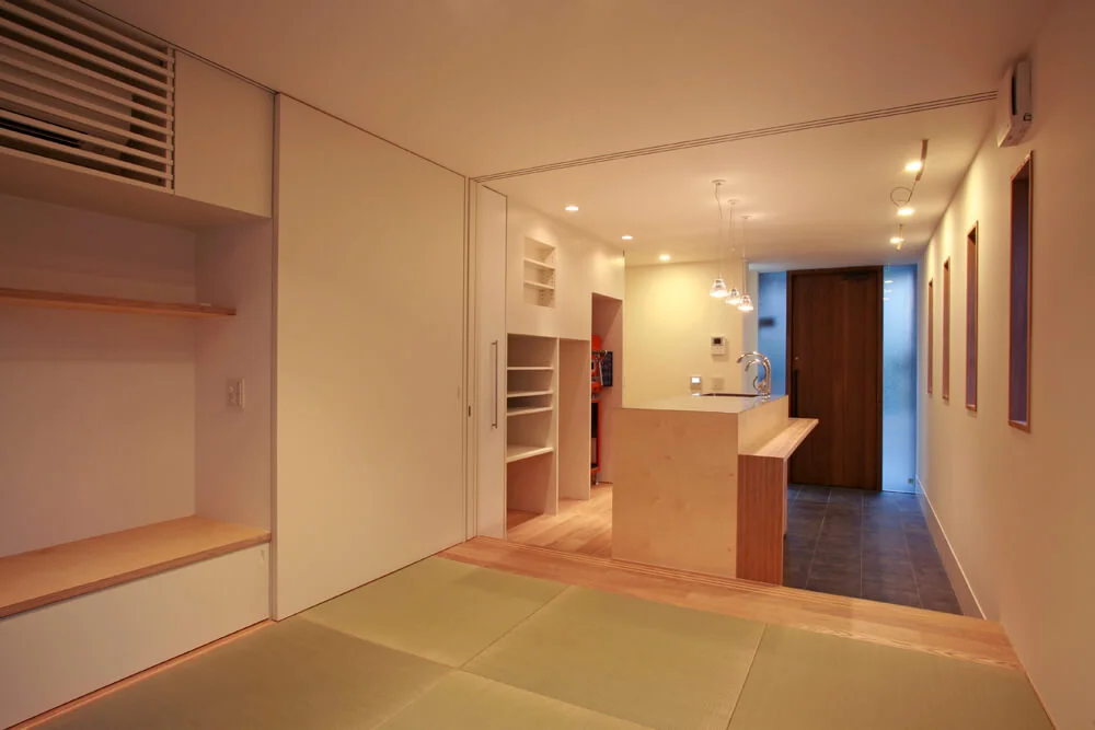Behind the kitchen, a professional-grade baking oven and dedicated appliance storage have been installed to support serious confectionery preparation