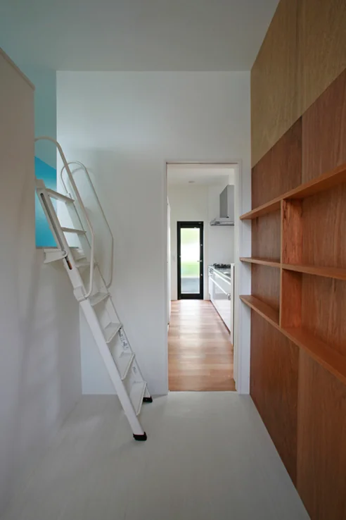 A ladder from the pantry adjacent to the kitchen leads up to the wife’s hobby room.