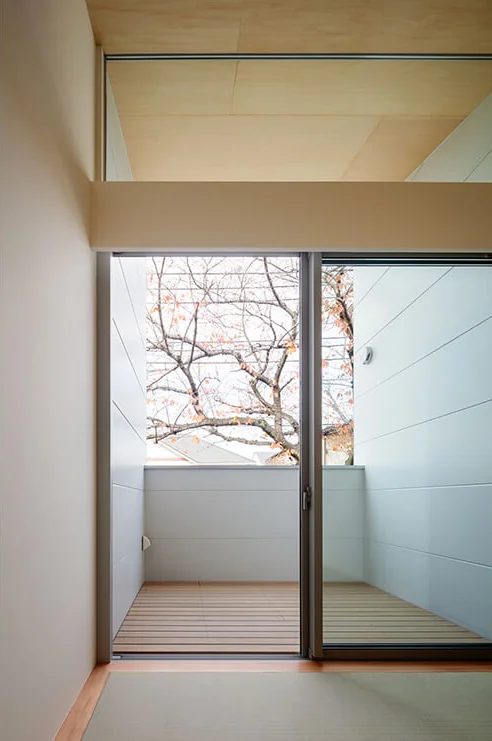 The covered north terrace, accessible without steps, allows for intimate appreciation of the nearby cherry trees.