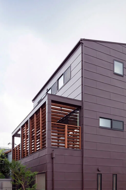 Second-floor terrace enclosed by wooden louvers