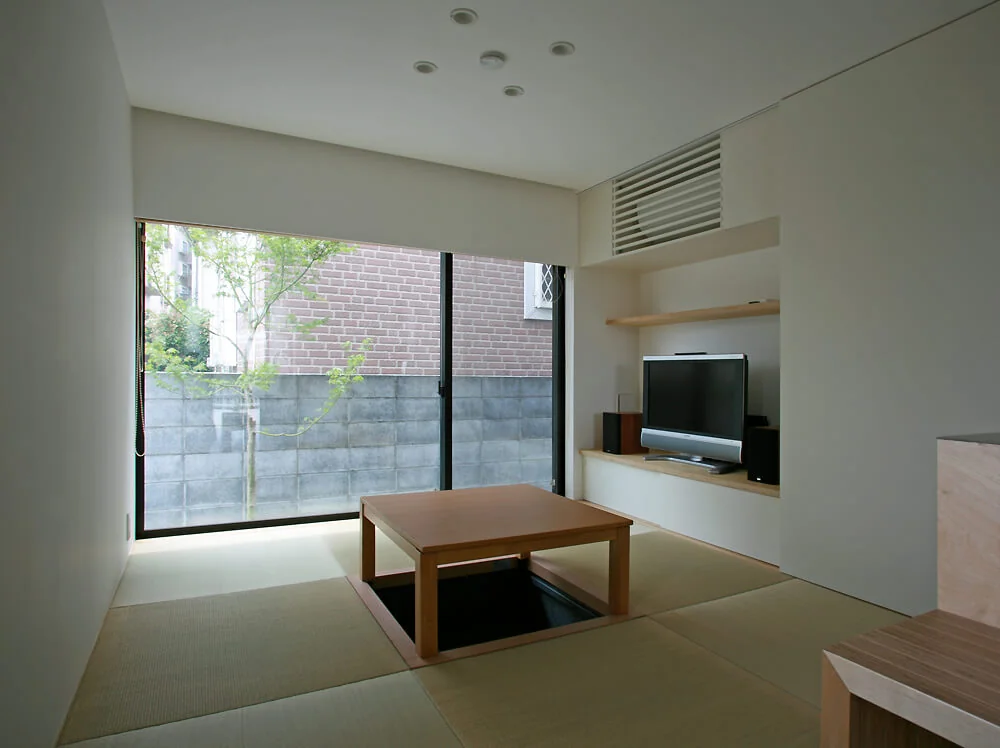The Japanese-style room with a sunken kotatsu serves as a welcoming space to entertain guests with homemade sweets, inspiring delightful moments