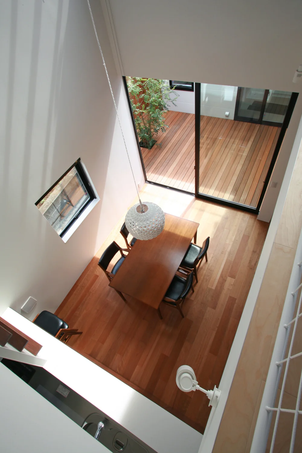 A vantage point from the atrium looks down onto the dining area and courtyard.