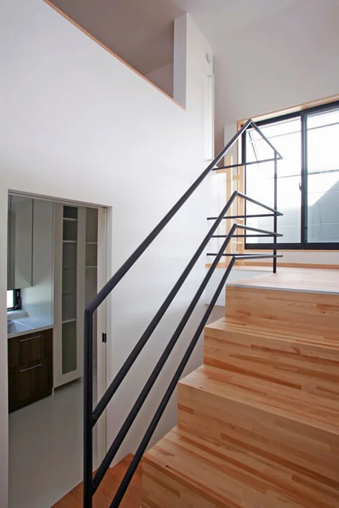 A half-floor ascent from the washroom leads to a sunlit drying terrace that is shielded from external view.