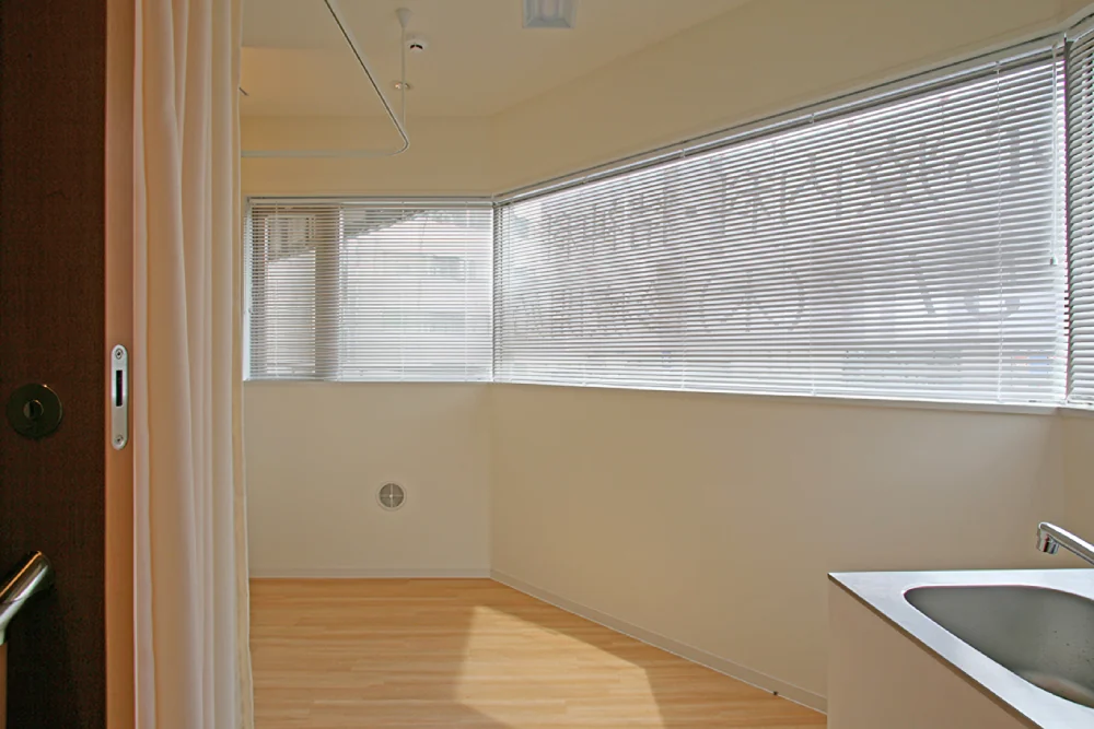 View into the treatment room through the open sliding entrance door