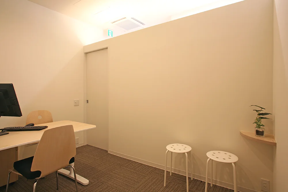 Natural light filters through upper wall openings, complemented by integrated lighting fixtures