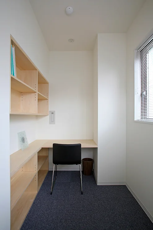 Built-in bookshelf and desk in the director’s office