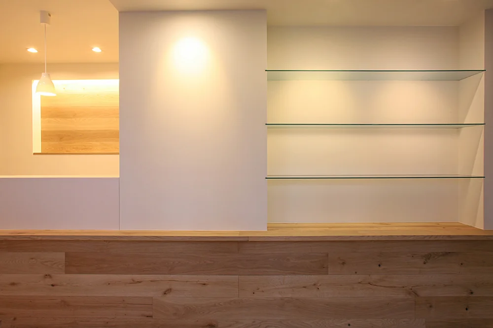 Directly facing the clinic entrance: reception on the left and glass display shelves on the right