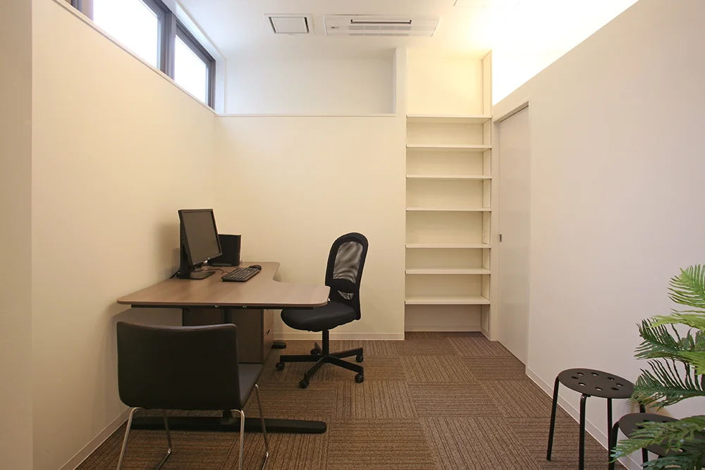 Consultation Room 1 features tile carpet flooring to ease patient anxiety