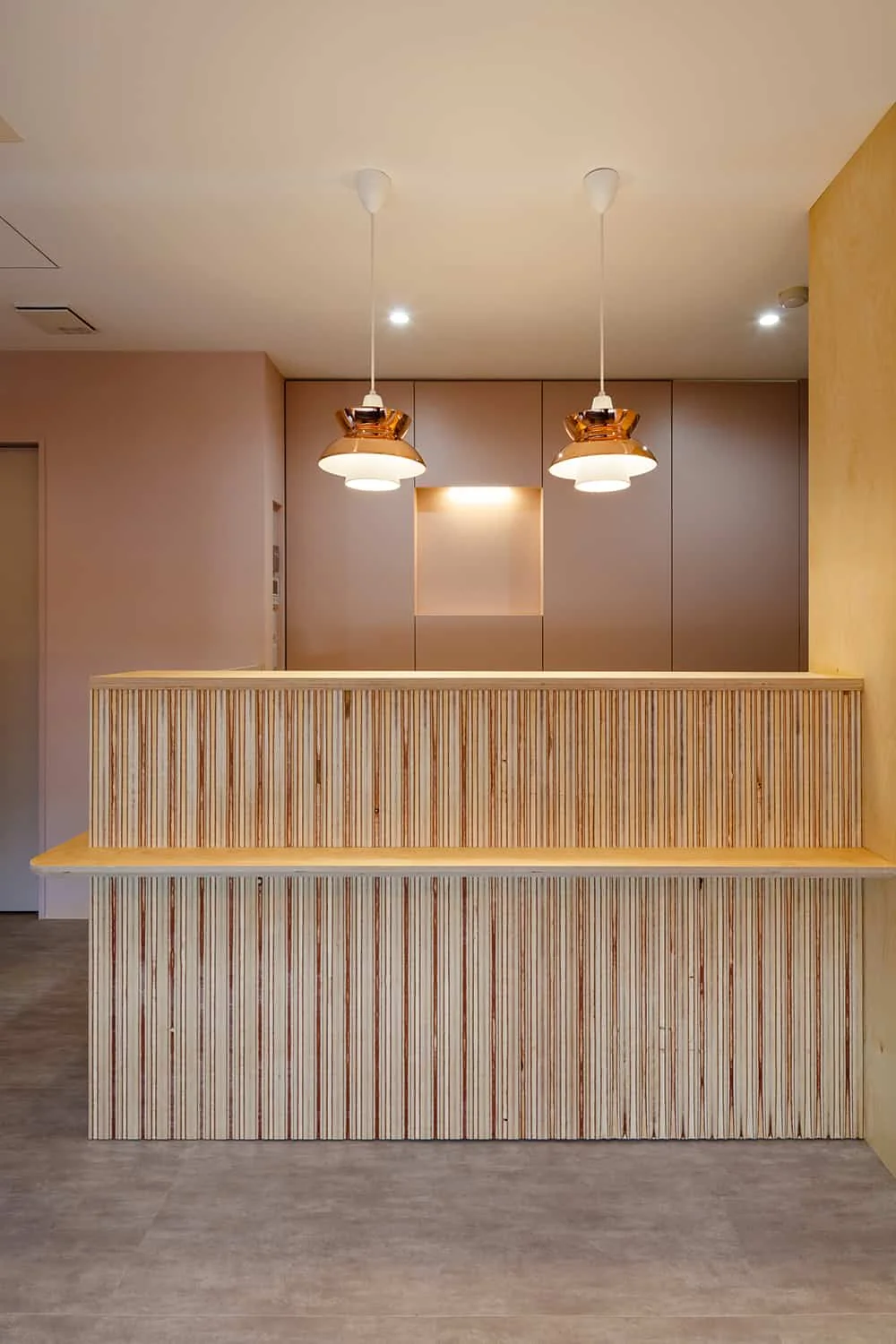 Back panel matching the interior wall color serves as storage; recessed areas accommodate signage.