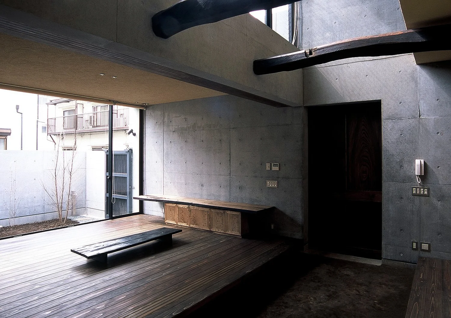 A balanced fusion of reclaimed wood and exposed reinforced concrete