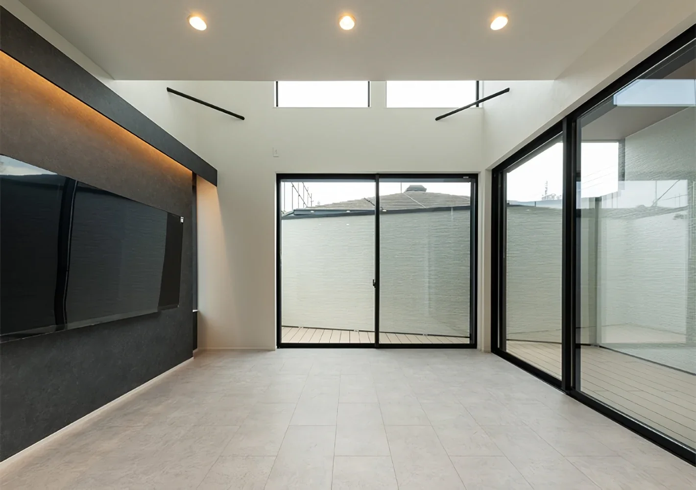 A House Opening Inward to Light and a Terrace