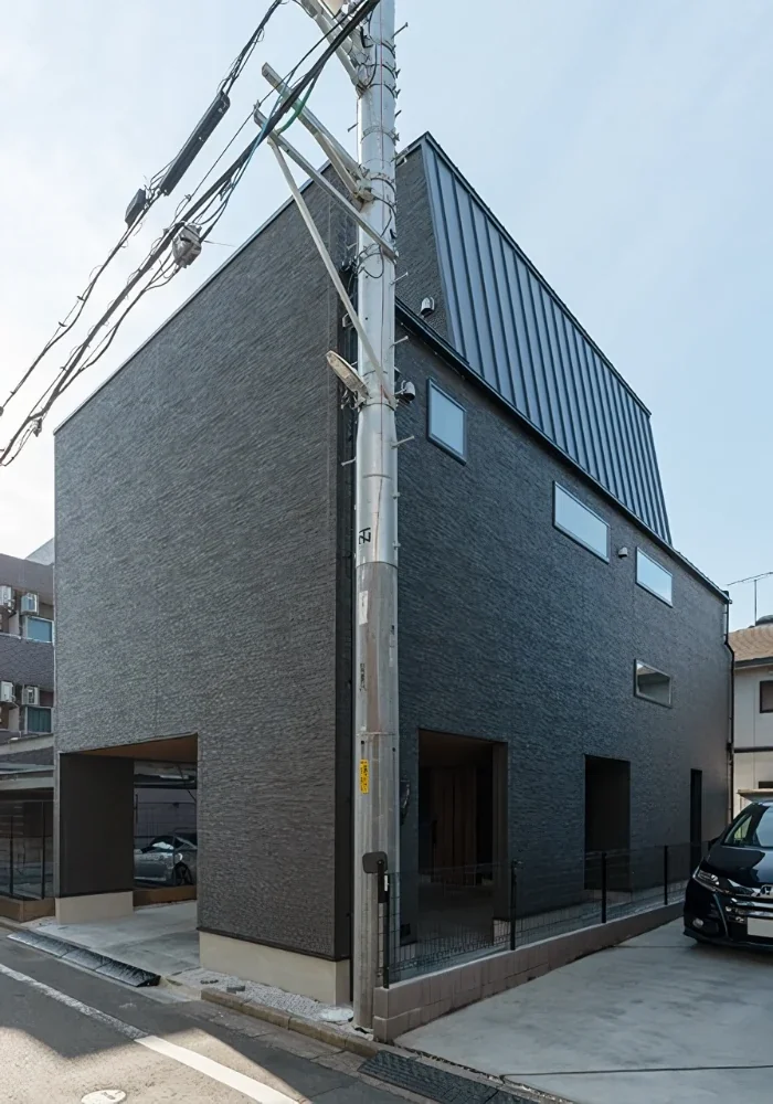 A House Opening Inward to Light and a Terrace