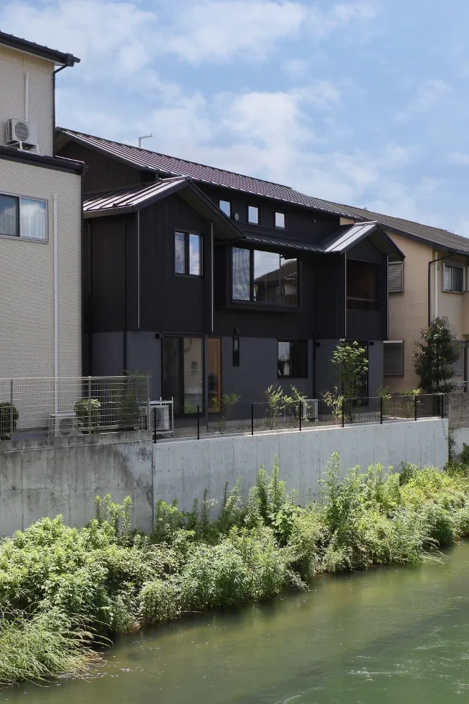 One side of the site faces the river. The intention is for planting to eventually grow densely across the entire area and cascade down to the riverbank.