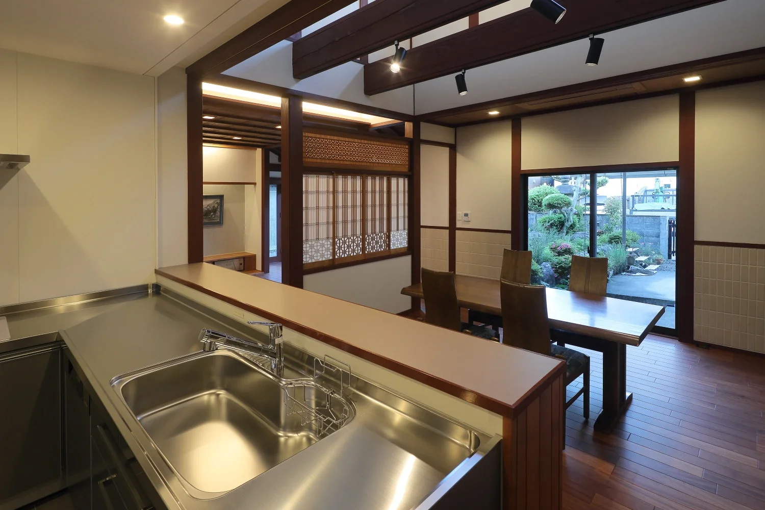 From the kitchen, there are views through the living and dining rooms to the garden.
