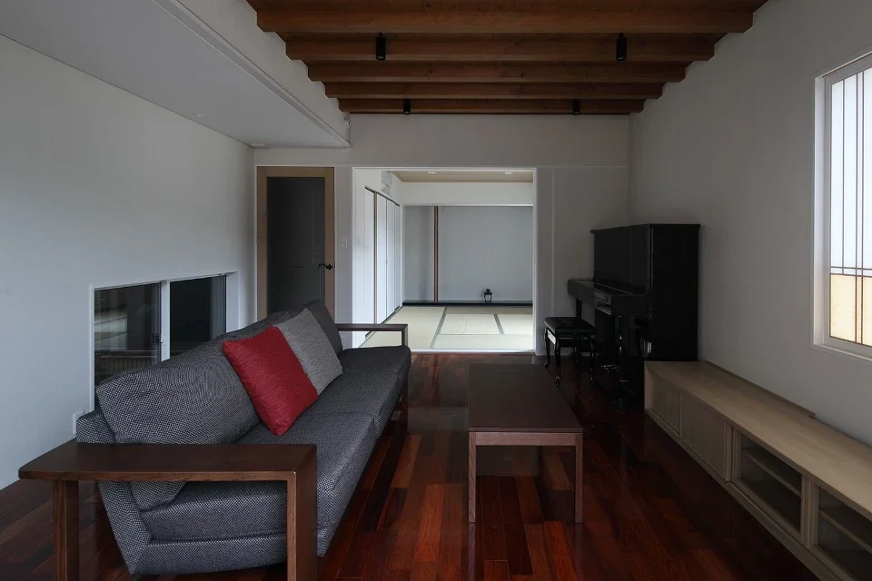 Opening the pocket doors connects the living room to the Japanese-style room.