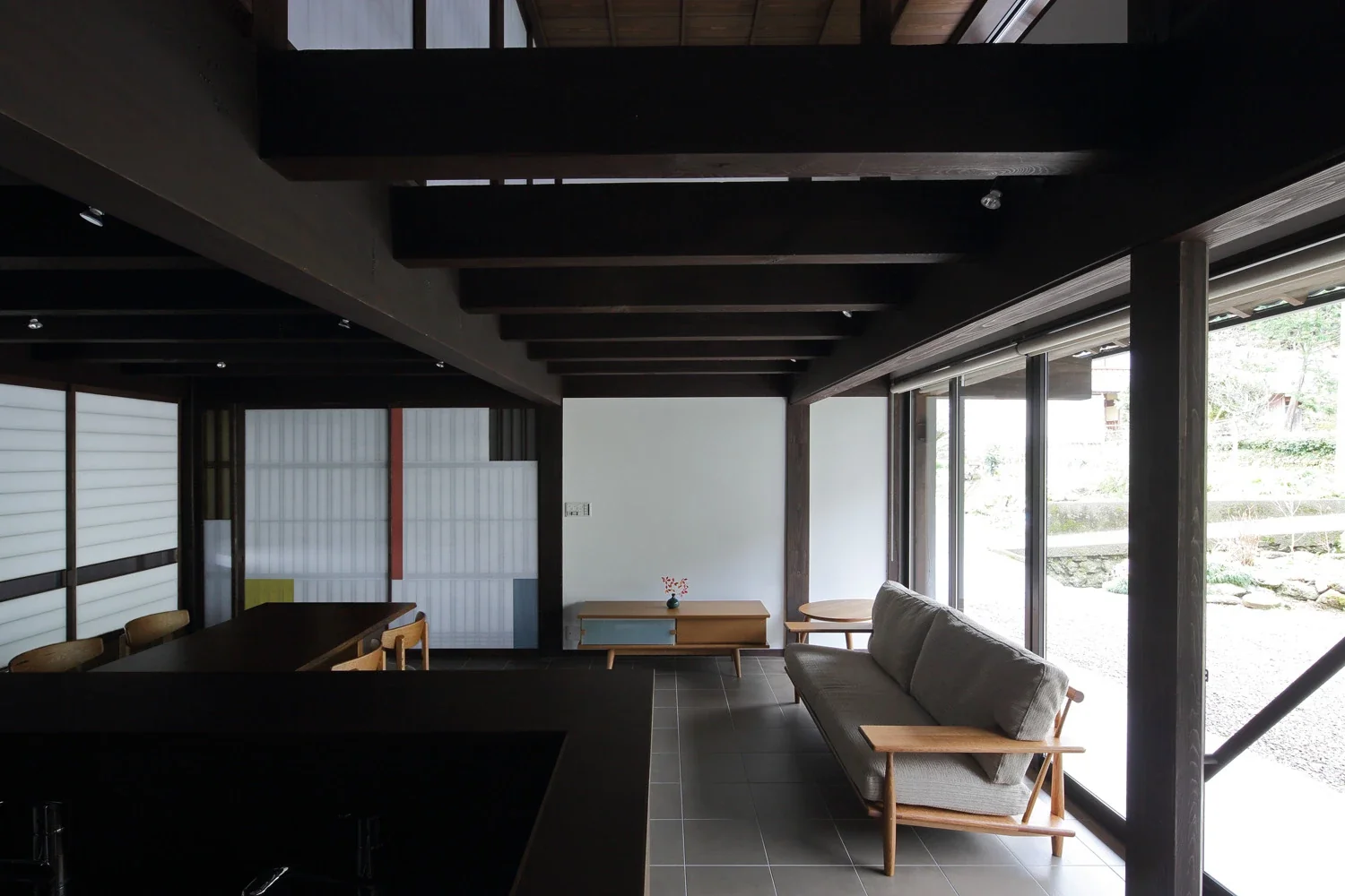 The southern half of the second-floor slab was removed to create a void, reducing the oppressive feeling of the low ceiling.