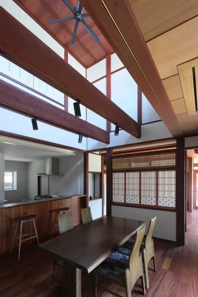 The paper shoji screens and ranma transom create a gentle connection with the living room.