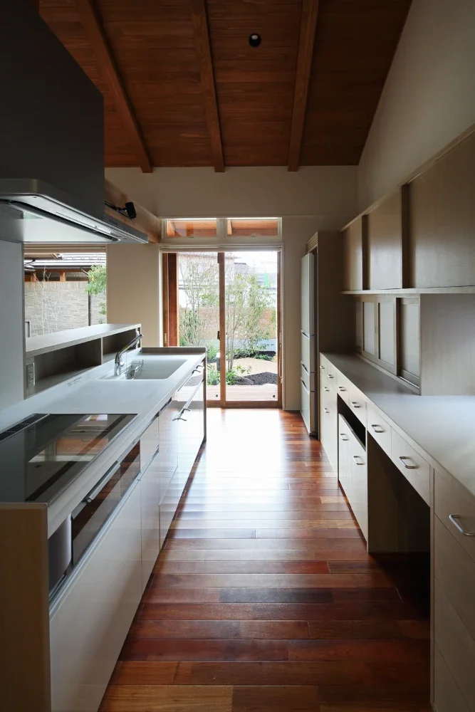 The kitchen counter screens the work area from the dining room.