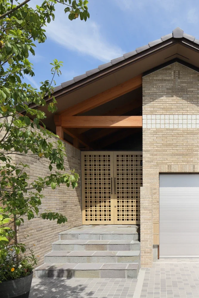 A wooden lattice door that opens inward.
