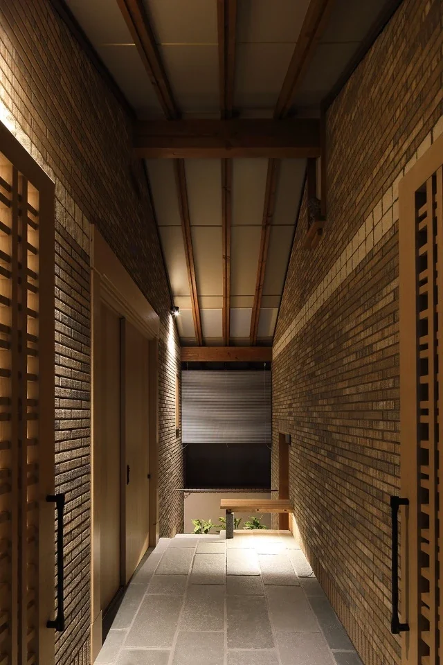 When the lattice gate opens, it reveals a generous, open-air space, with stairs from the garage and a seat at the back.