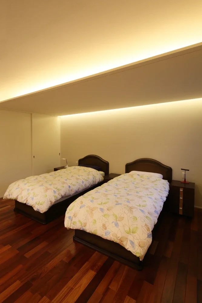 The main bedroom uses indirect lighting to reduce glare.