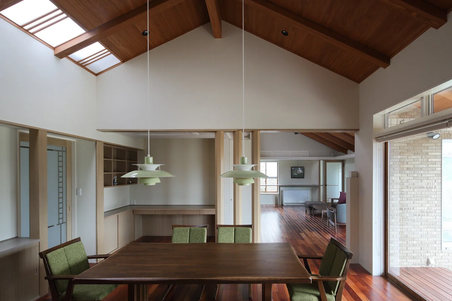 A PC desk area has been provided in one corner of the dining room.