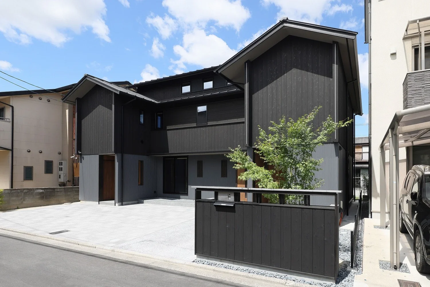 A low wall clad in the same charred cedar has been provided.