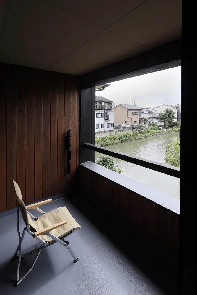 A spacious terrace opens toward the river.