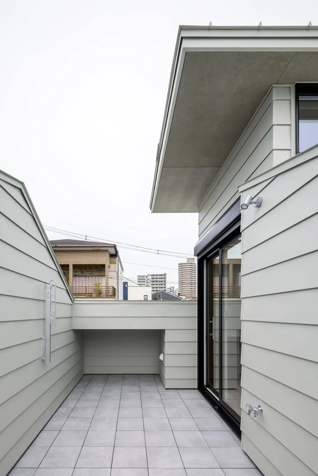 The rooftop serves as a play area with a children's pool.