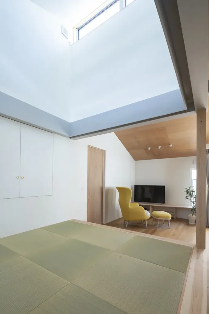 Sunlight streaming through the clerestory windows is further diffused by the white walls, illuminating the entire interior space.