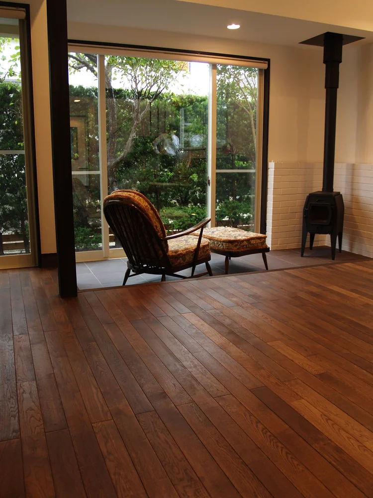 The expansive space is gently enveloped in warmth by radiant floor heating and a wood-burning stove.