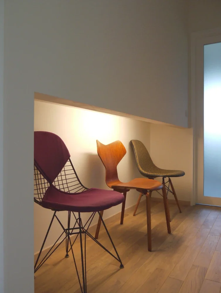 Single-story house inhabited by a chair collector