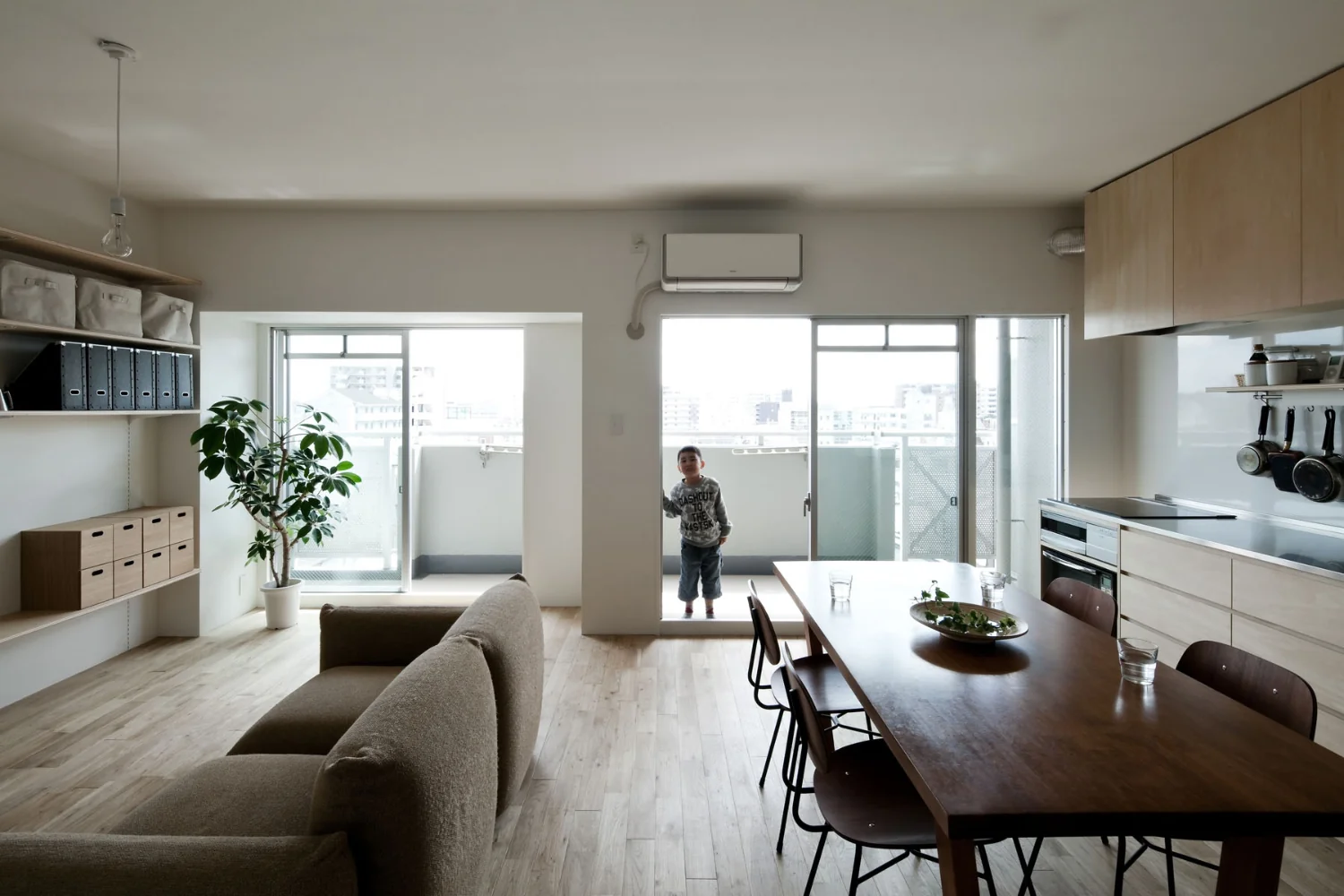 Converted into a large open-plan studio by removing partitions and the ceiling.