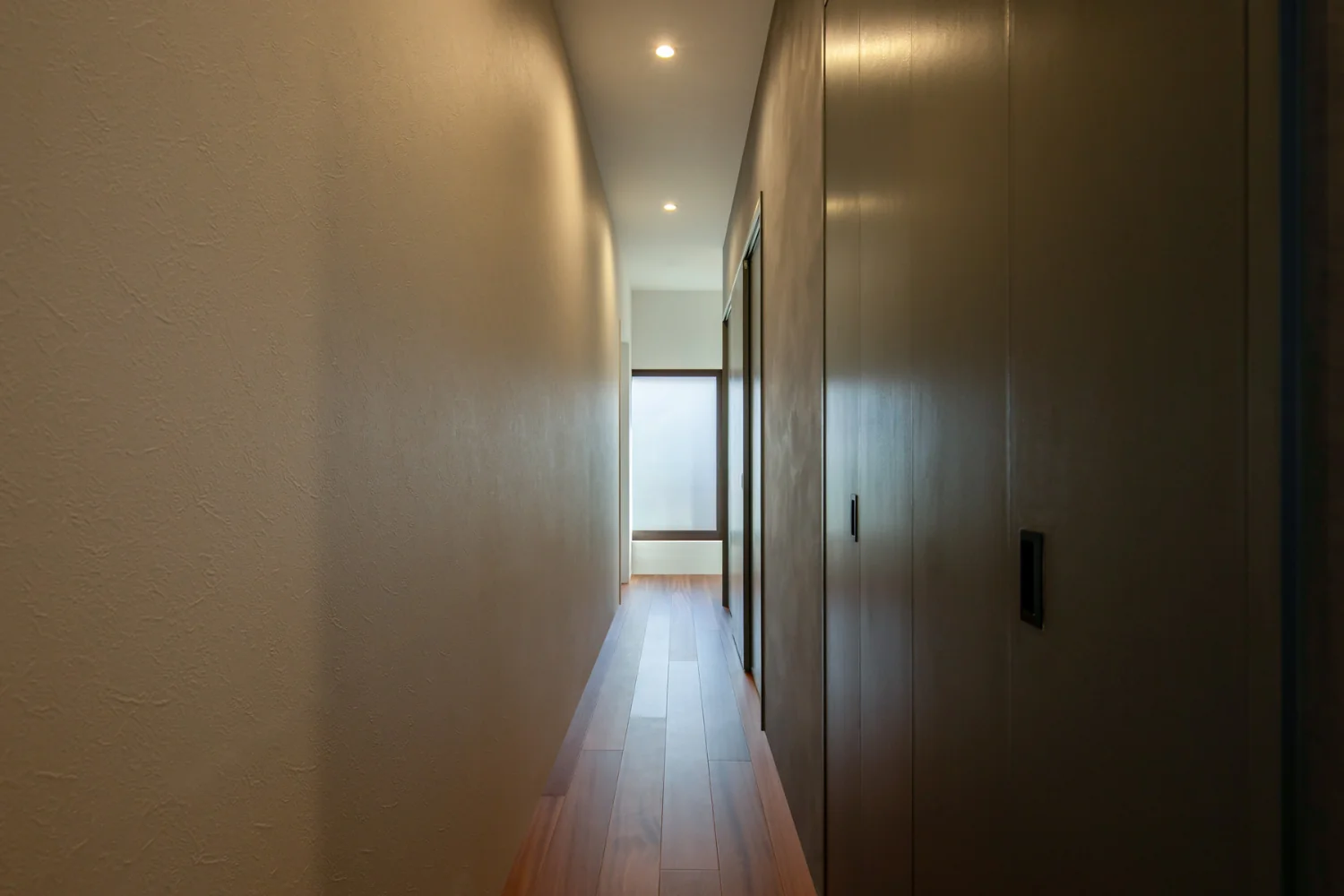 The rear side of the backset contains a large pantry, accessible from both ends of the kitchen.