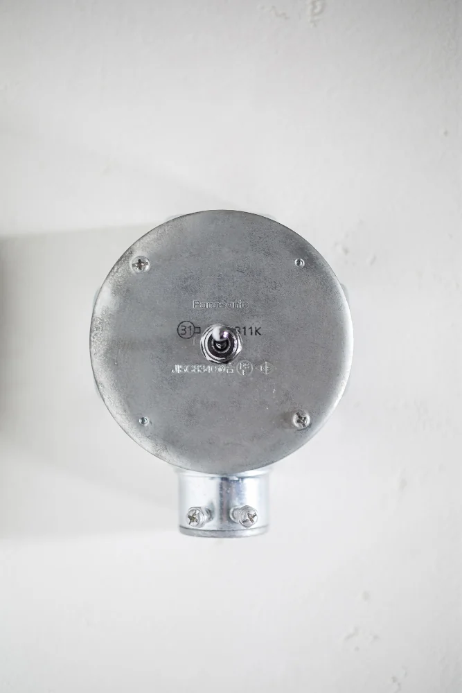Toggle switch installed using a junction box.