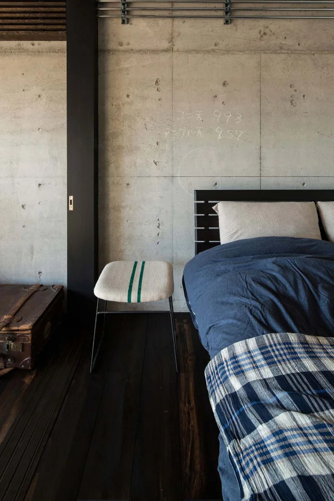 Exposed fair-faced concrete walls that retain the craftsmen's chalk marks.