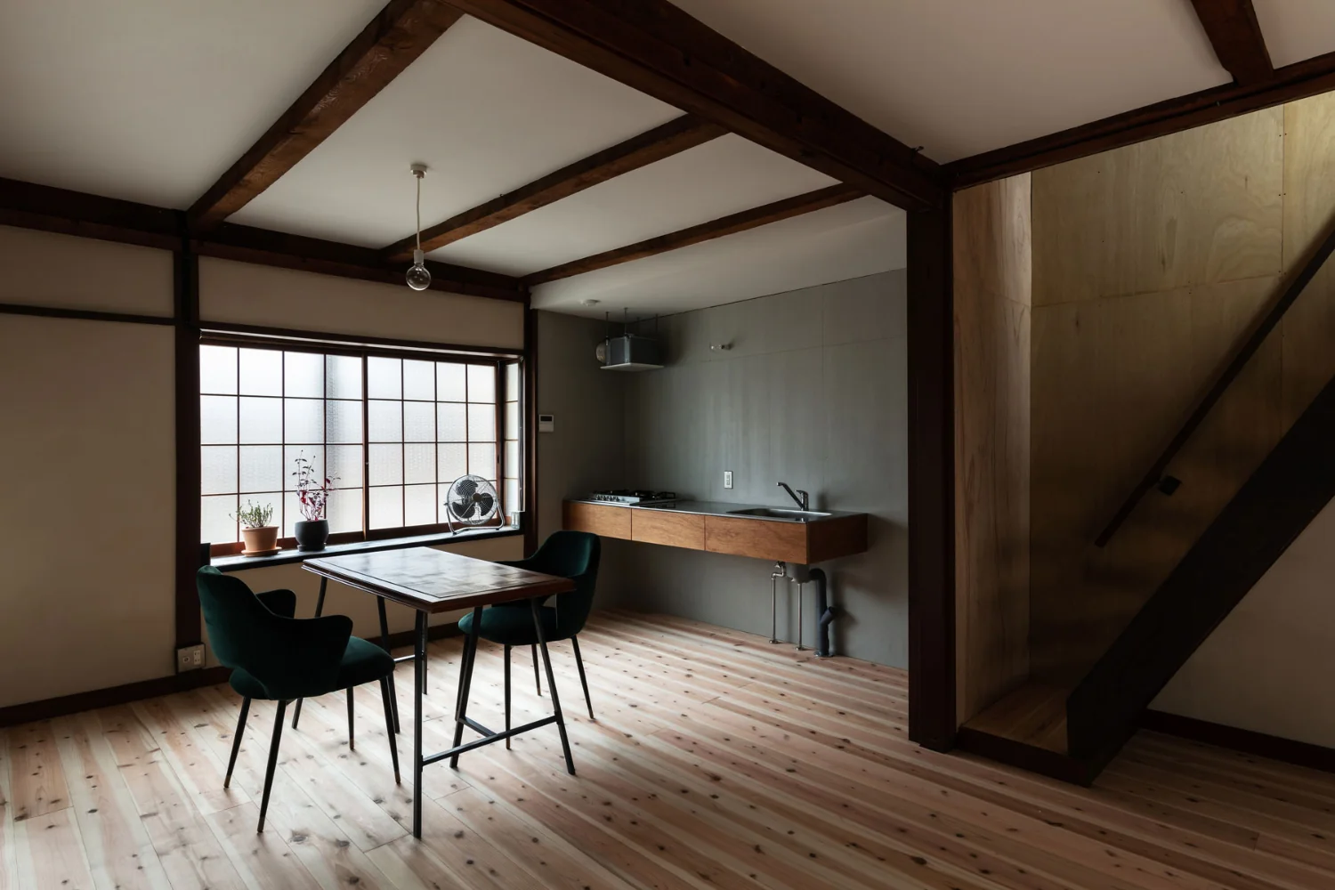 Converted the previously dim two adjacent tatami rooms into a large cedar‑clad living room, rehabilitating the property as a family‑oriented residence.｜Renovation Bringing Light to a Rental Row House | Row House on Showa Alley II