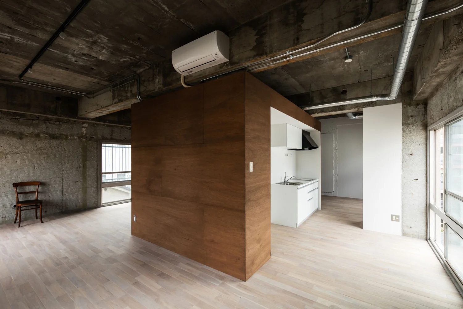 Consolidating services within a boxed core minimizes renovation costs while maximizing occupant flexibility.
