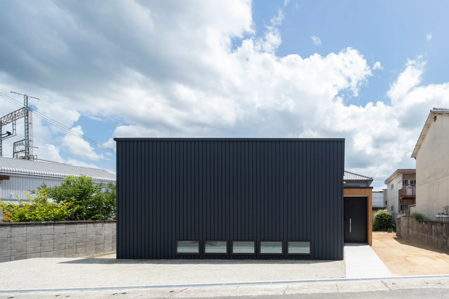 A very compact house designed for a single adult on a generous suburban plot.