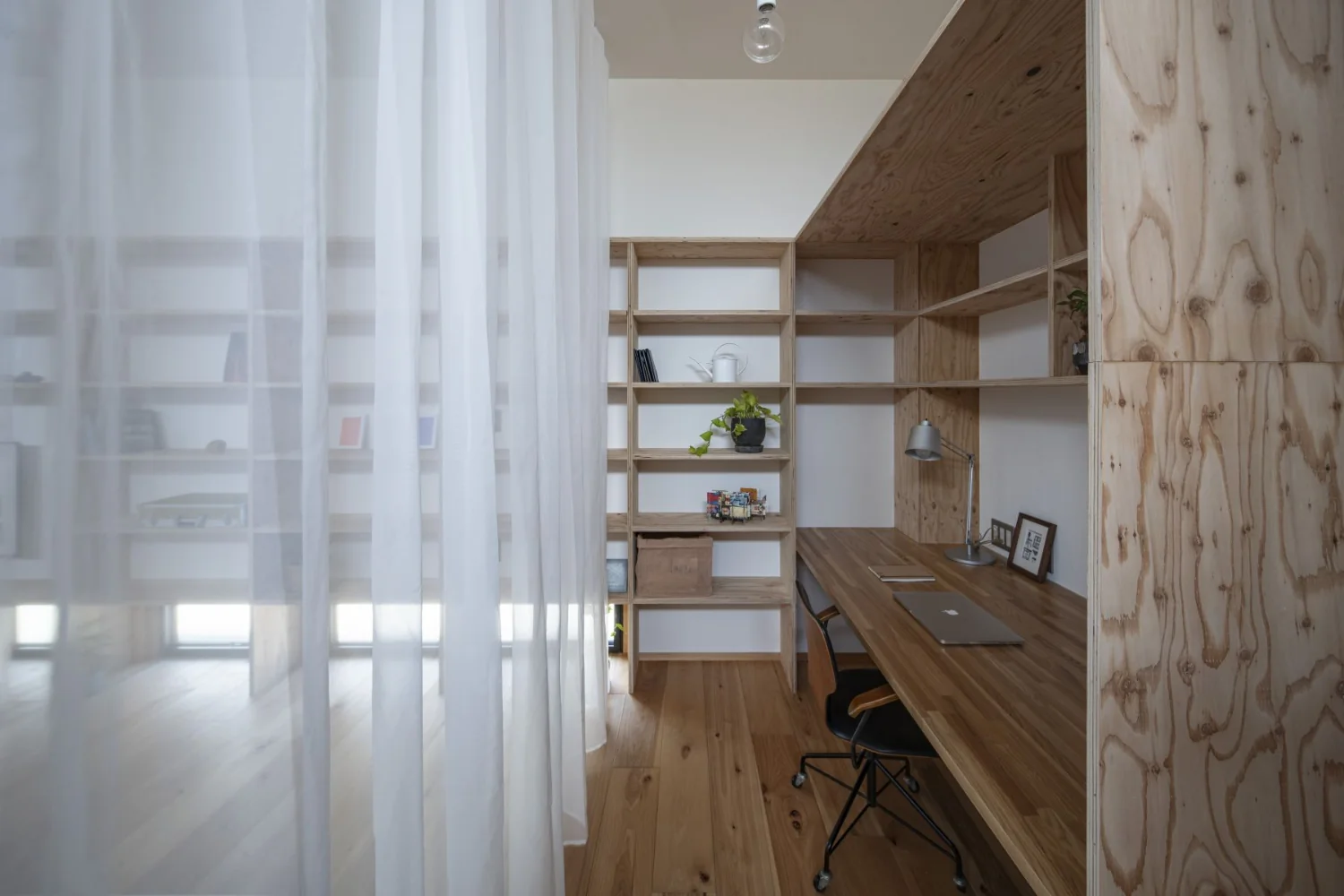 A generously sized workspace designed to accommodate a large display.
