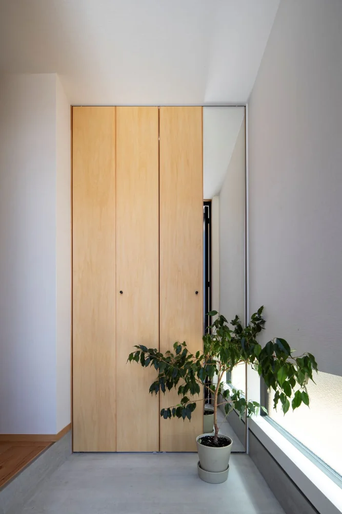 Entrance mudroom. Custom joinery that doubles as a full-length mirror.