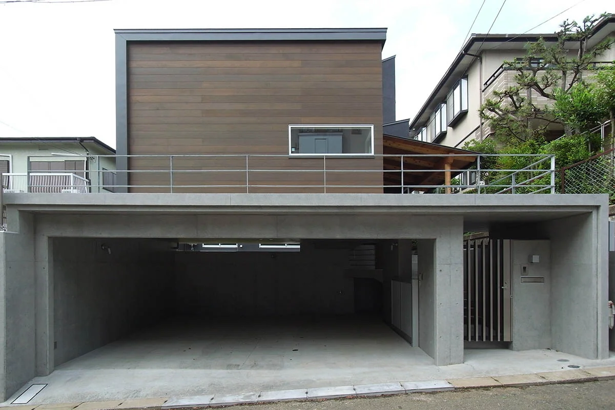Covered access from the garage to the entrance allows entry into the building without exposure to rain.