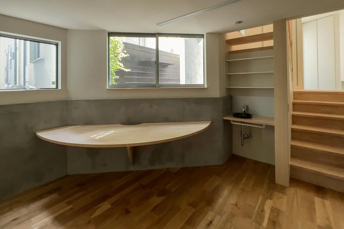 Semi-basement workroom overlooking the courtyard, providing a focused environment for work
