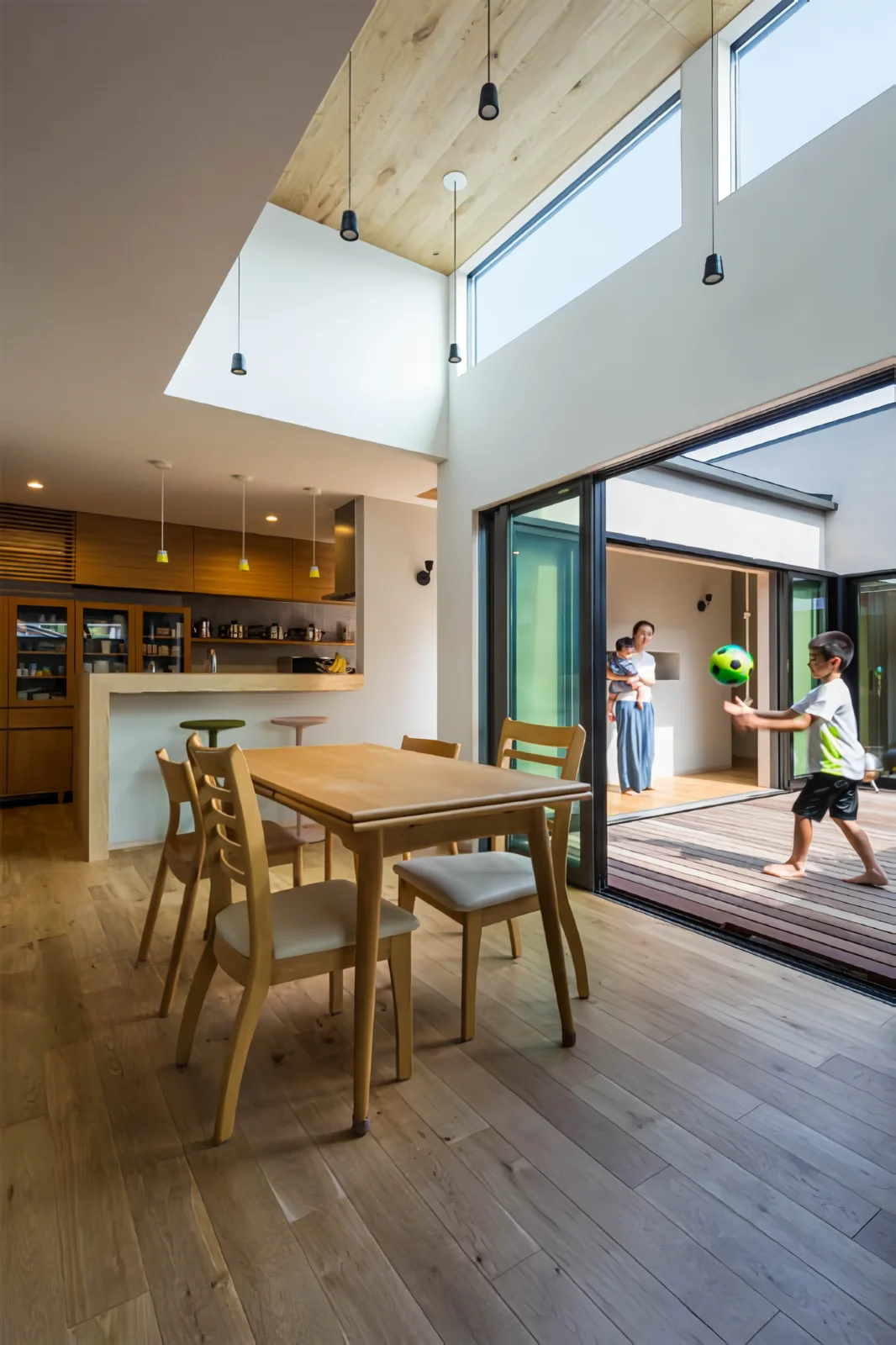 View of the south-facing courtyard from the living, dining, and kitchen area (LDK).
